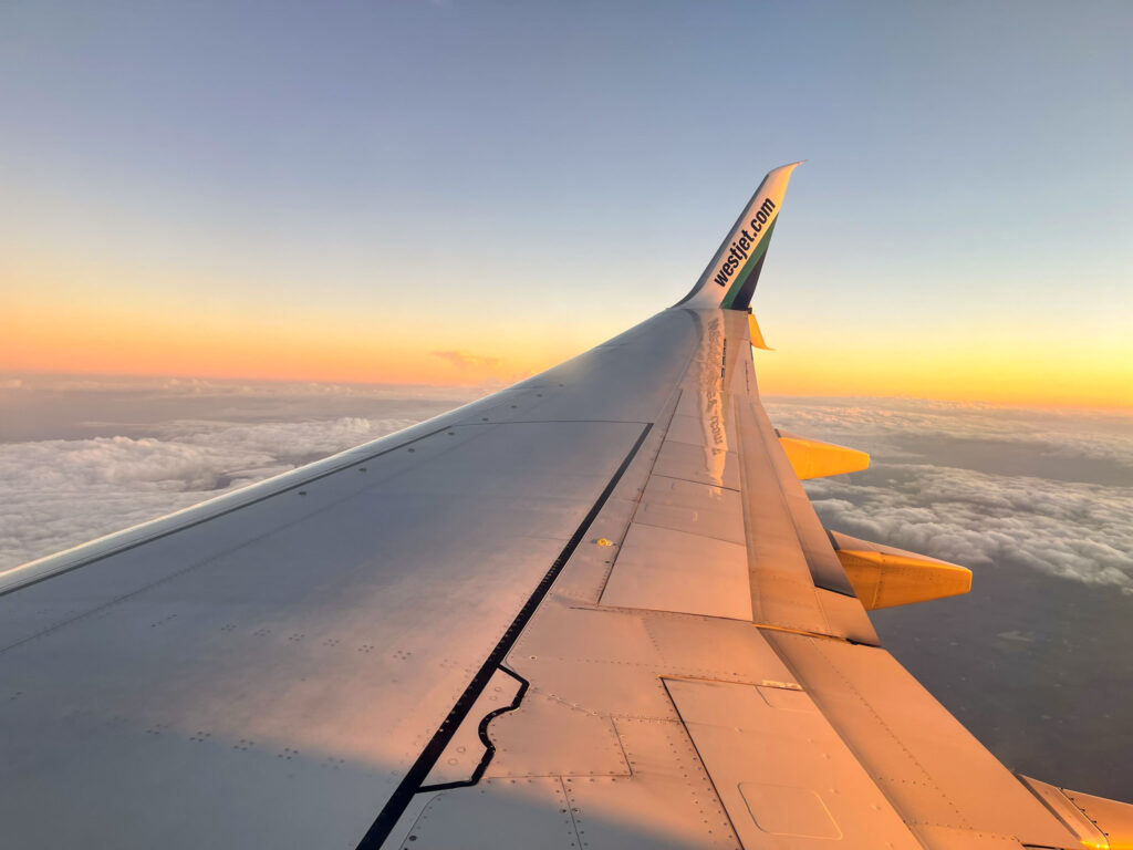 flying on an airplane during sunset