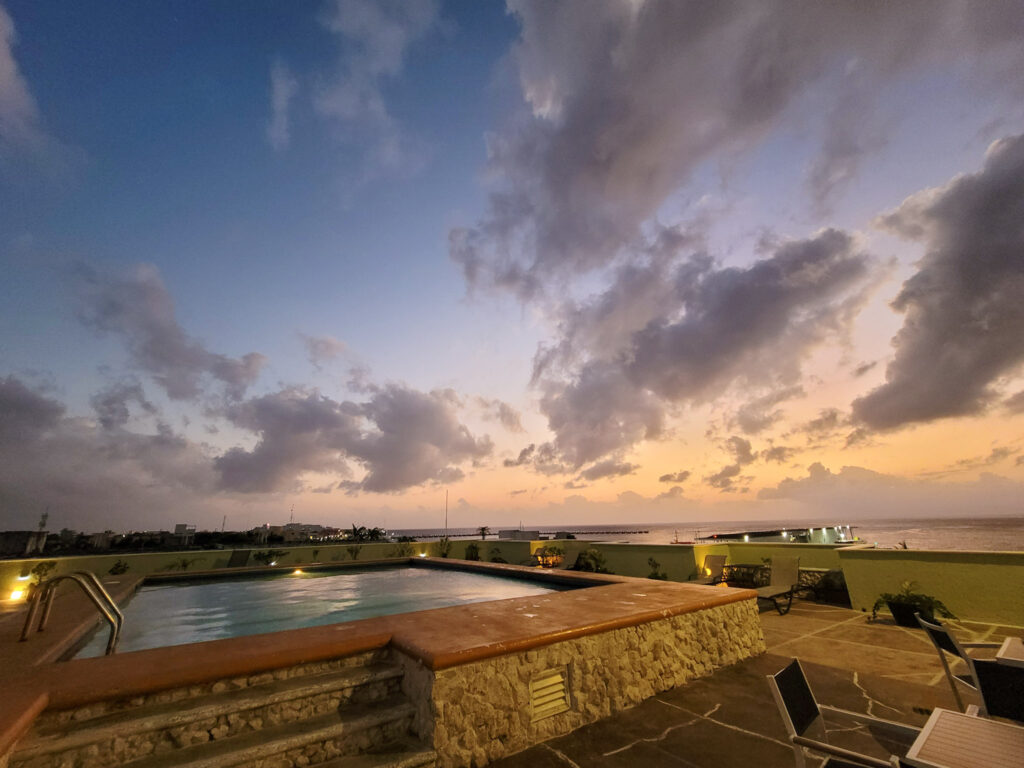 sunset on a rooftop pool on Cozumel Island in Mexico